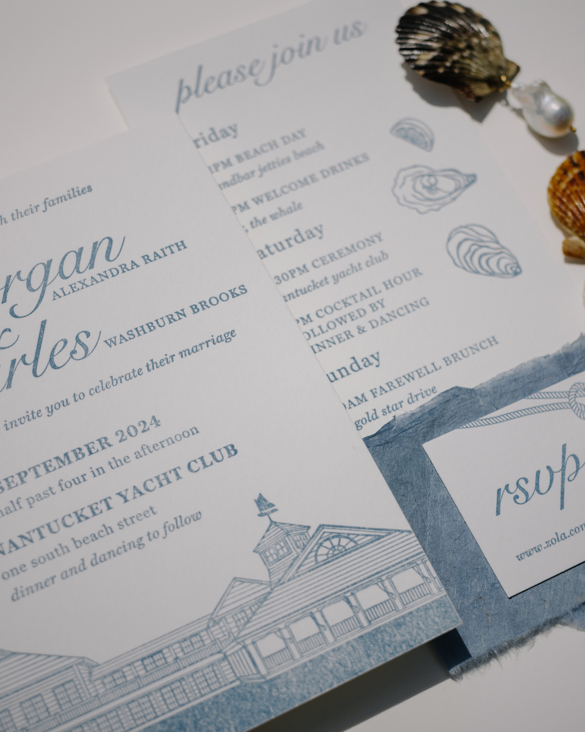 Nautical-themed wedding invitation with shell decorations on a white background