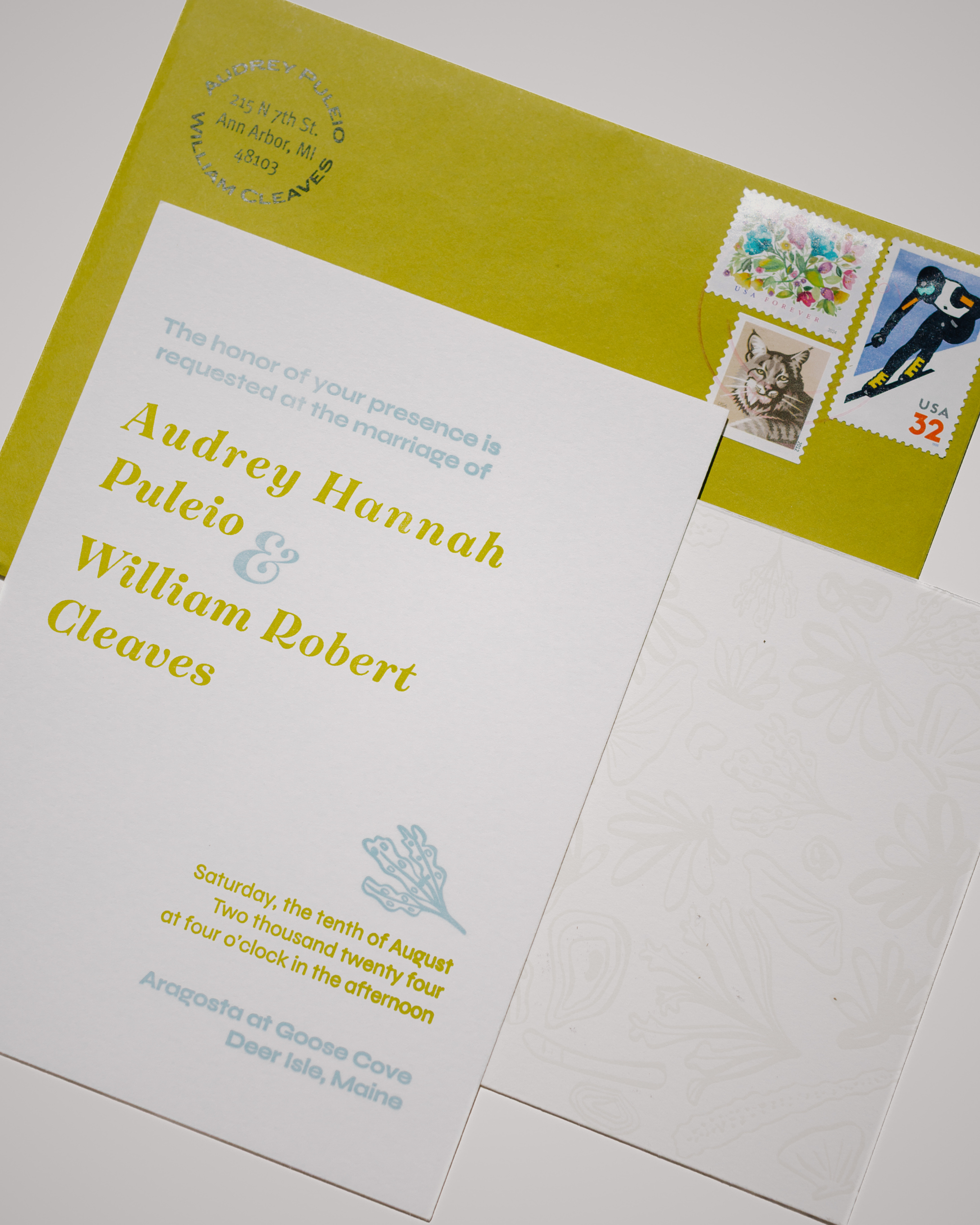 Wedding invitation with stamps on a white background