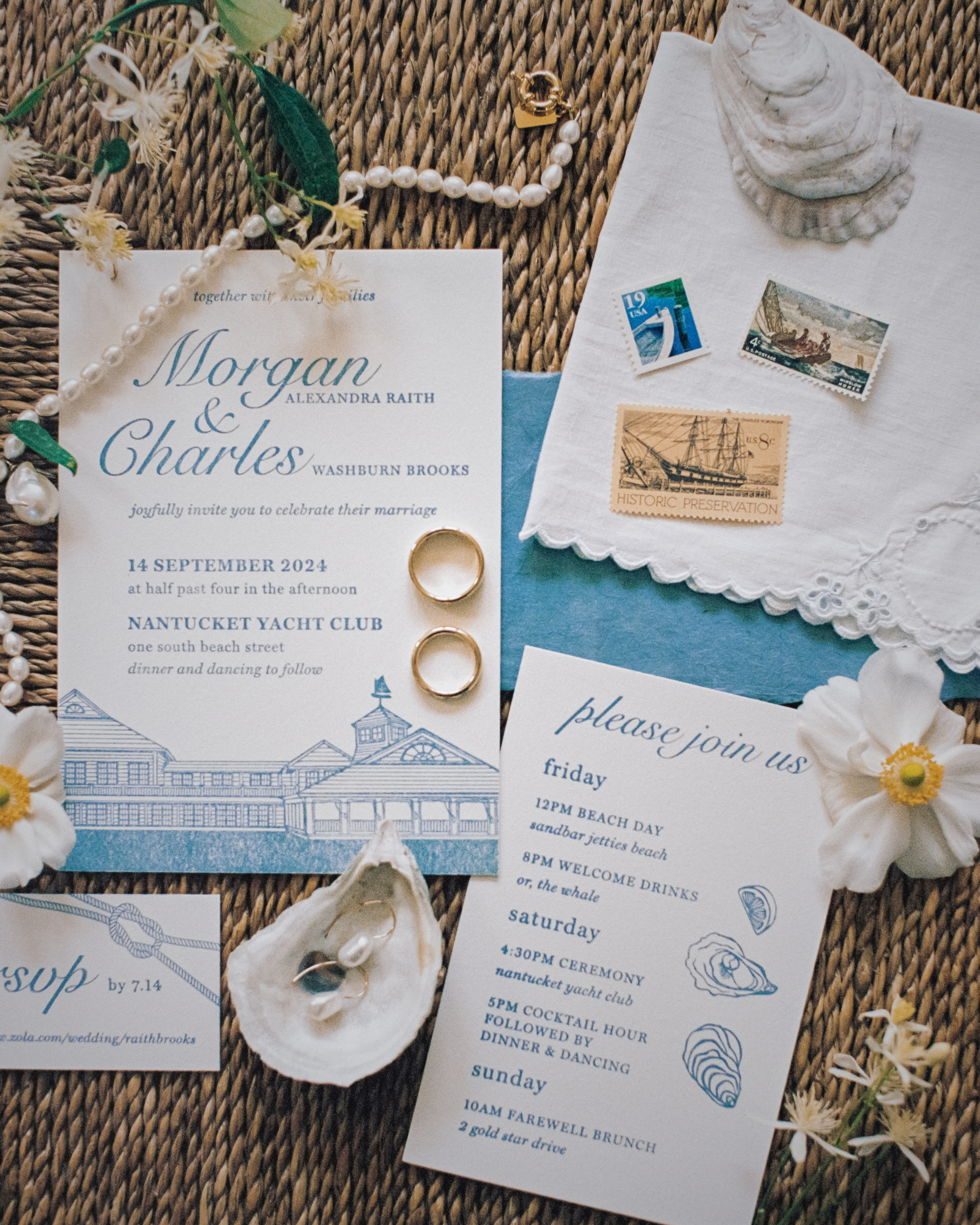 Nautical-themed wedding invitation with rings and decorative elements on a textured surface.