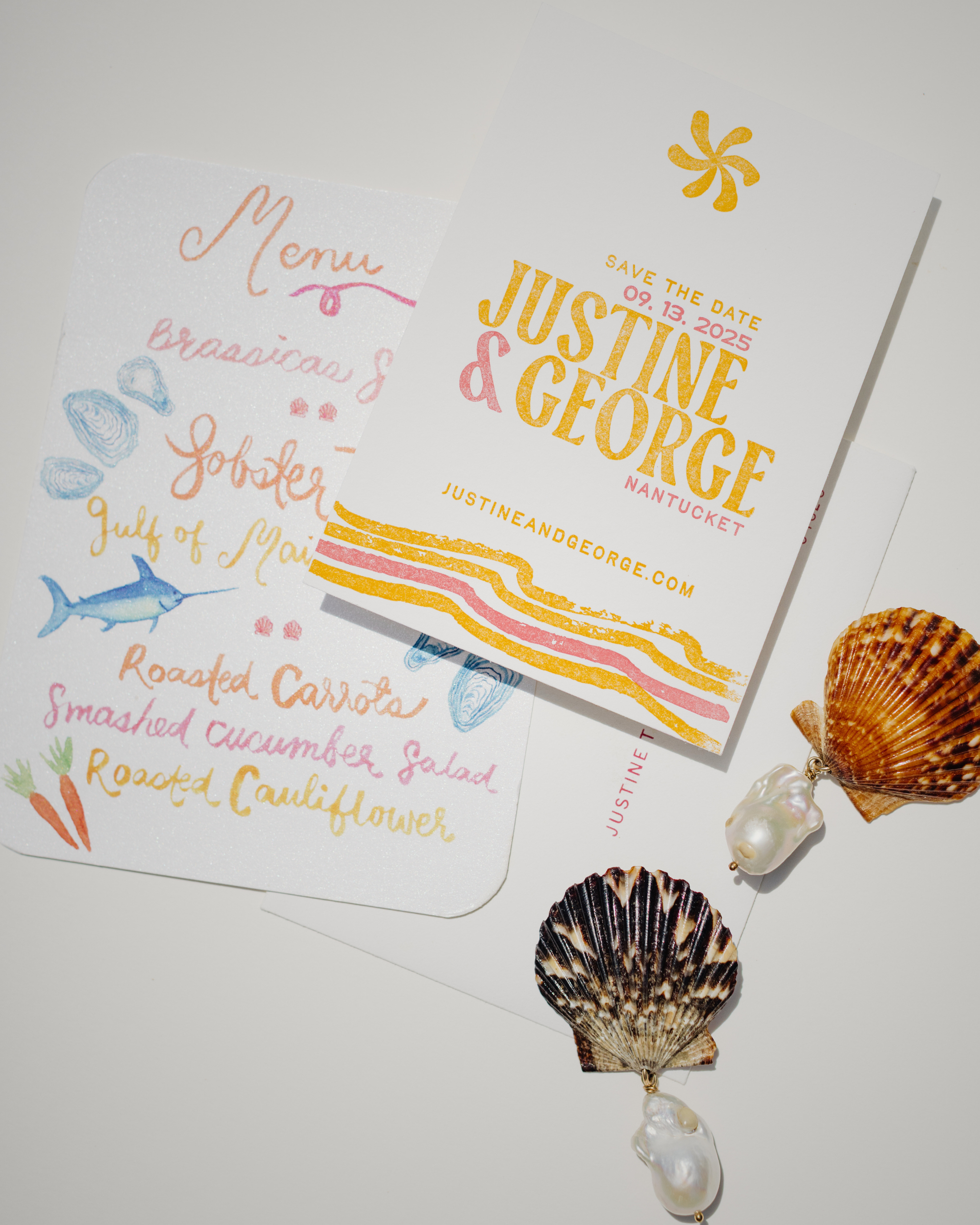 Colorful wedding invitation with seashells and pearls on a white background