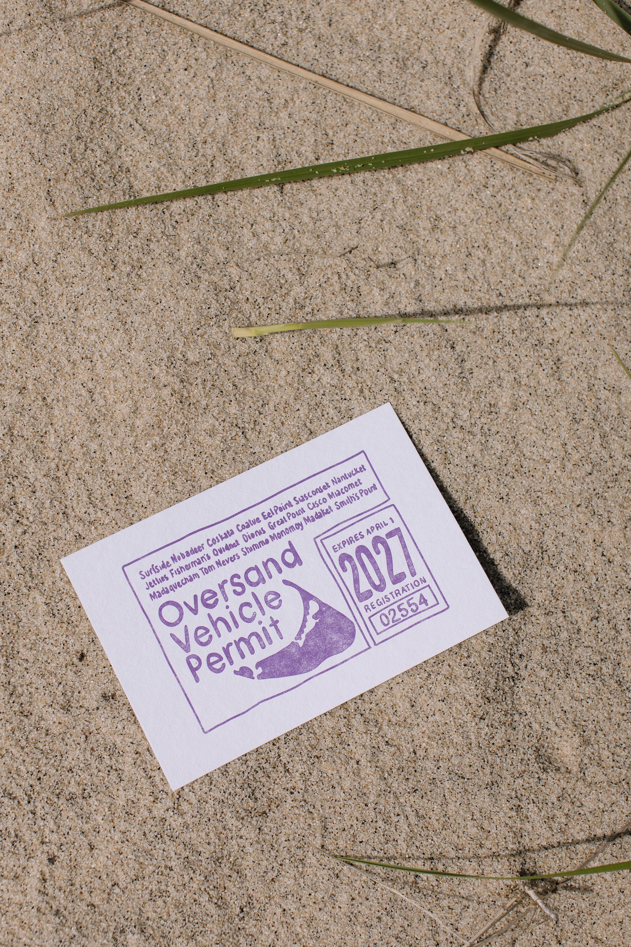 Postcard with purple Oversand Nantucket Vehicle permit illustration on sand